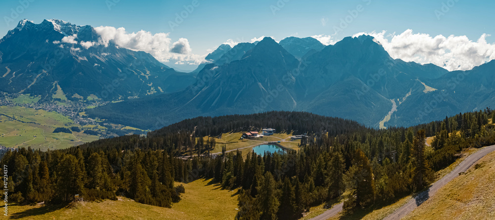 High resolution panorama of a beautiful alpine summer view with the famous Zugspitze summit, top of germany, seen from the Grubigstein summit near Lermoos, Tyrol, Austria