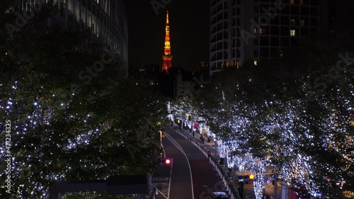 TOKYO, JAPAN - NOVEMBER 2021 : Christmas illumination, led light up at Roppongi Keyaki-zaka (Keyaki hill). Scenery of downtown city and street at night. Japanese winter and Christmas season concept. photo