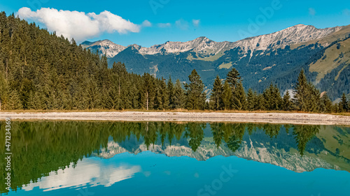 Fototapeta Naklejka Na Ścianę i Meble -  Beautiful alpine summer view with reflections in a pond at the famous Grubigstein summit near Lermoos, Tyrol, Austria