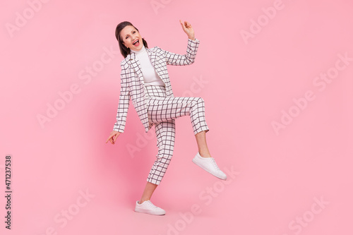 Full size photo of funky smiling grandmother feeling young dancing on weekend isolated on pink color background