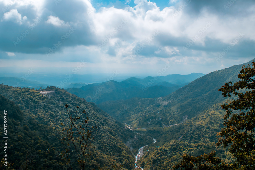 View of mountains from top under cloudy sky in Uttarakhand View of mountains from top under cloudy sky in Uttarakhand