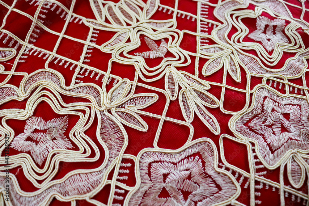 white pattern on red cloth