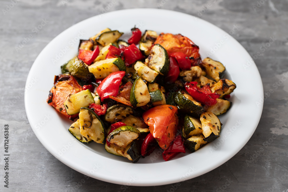 grilled chopped vegetables in white small dish