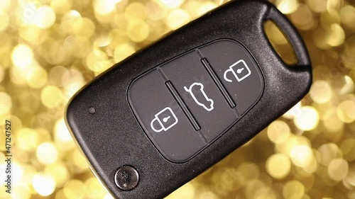 car key on a golden background