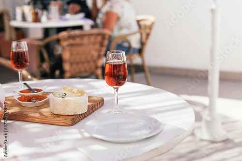 A traditional Portuguese drink Moscatel with cheese, jam and bread on a terrace in a cafe, Portugal  photo