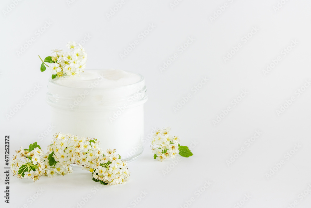 Herbal facial cream cosmetic for skin care with white flowers