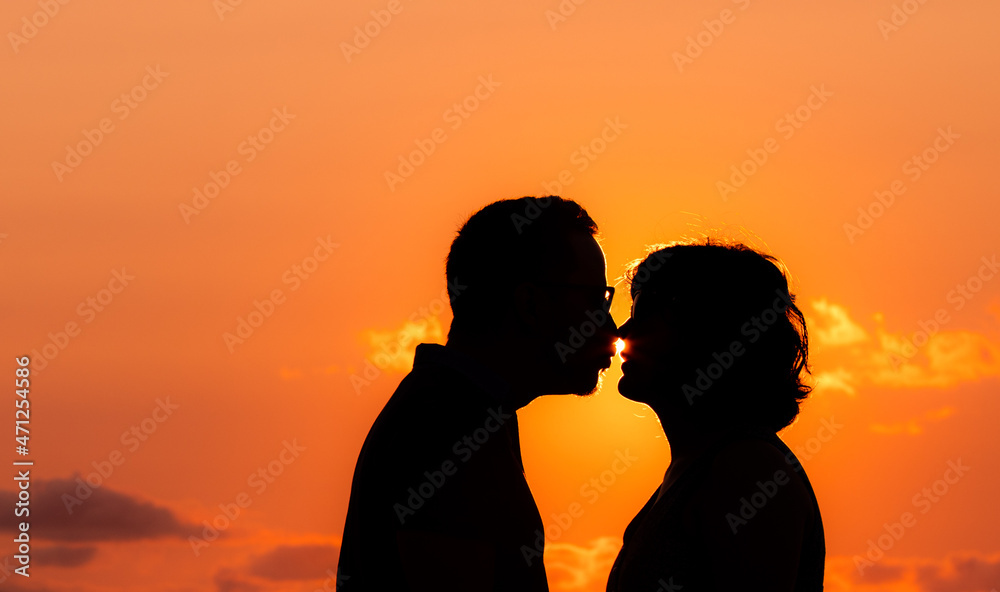 Couple in sunset, silhouette, love and friendship, Azores beach.