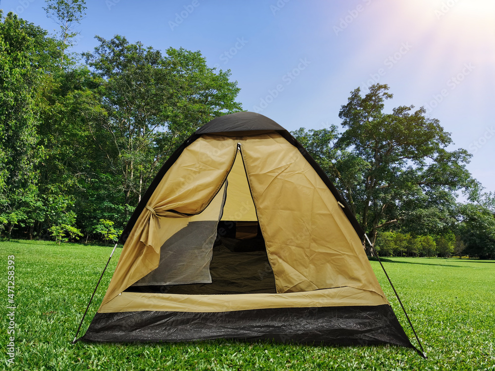 black and yellow tourist tent on green lawn ecotourism protect the environment