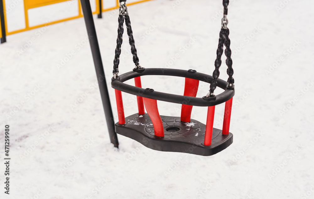 Special swings for babies on the playground in winter Special swings for babies on the playground in winter