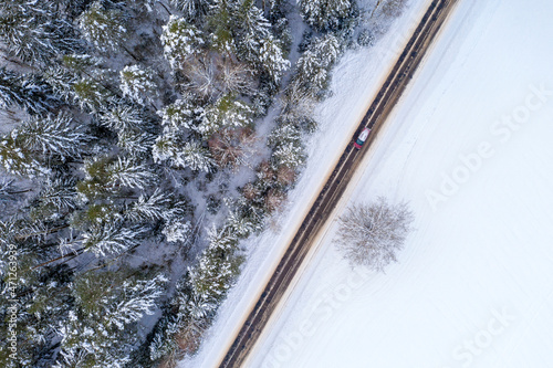 Aerial bird-eye view on freeway road in the winter forest © yauhenka