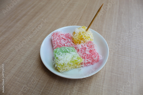 Ongol-ongol, is a traditional snack from Indonesia. Sweet and chewy texture, with coconut sprinkles photo