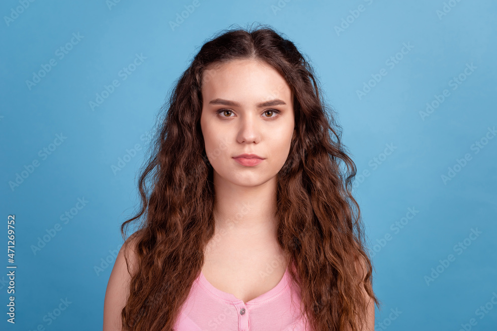 Photo of youth confident lady smart wavy hair good mood wear casual clothes isolated over blue color background