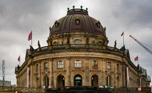 Great close-up view of the historical entrance to the Bode-Museum, located on the northern tip of the Museum Island between Spree and Kupfergraben in Berlin on a cloudy and gloomy day.  photo
