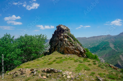 Lonely rock in a mountain valley in the Caucasus