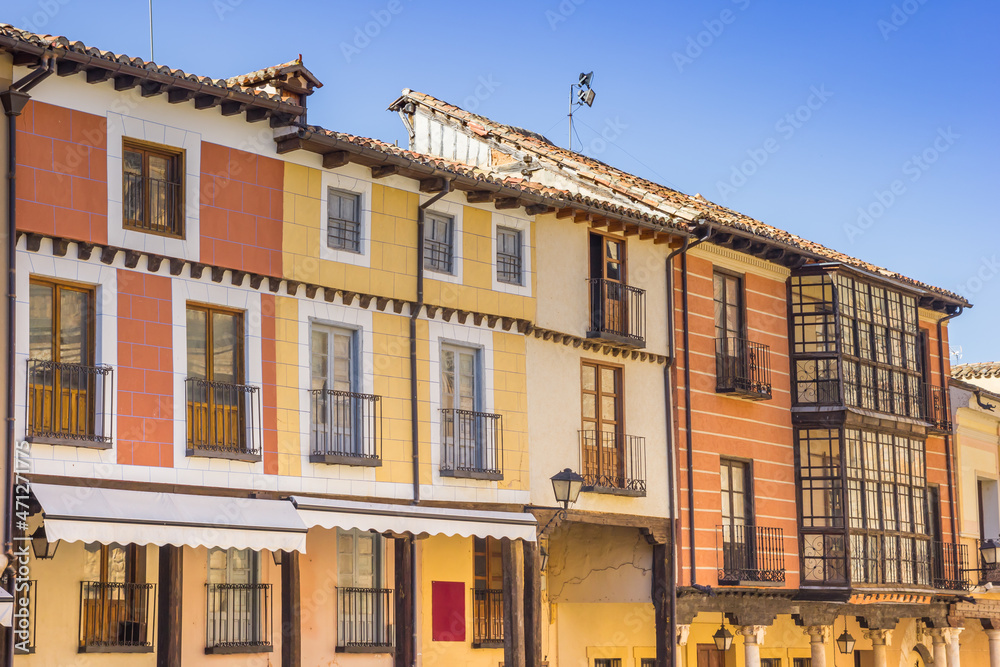 Colorful houses with bay windows on the cathedral square of Burgo de Osma, Spain