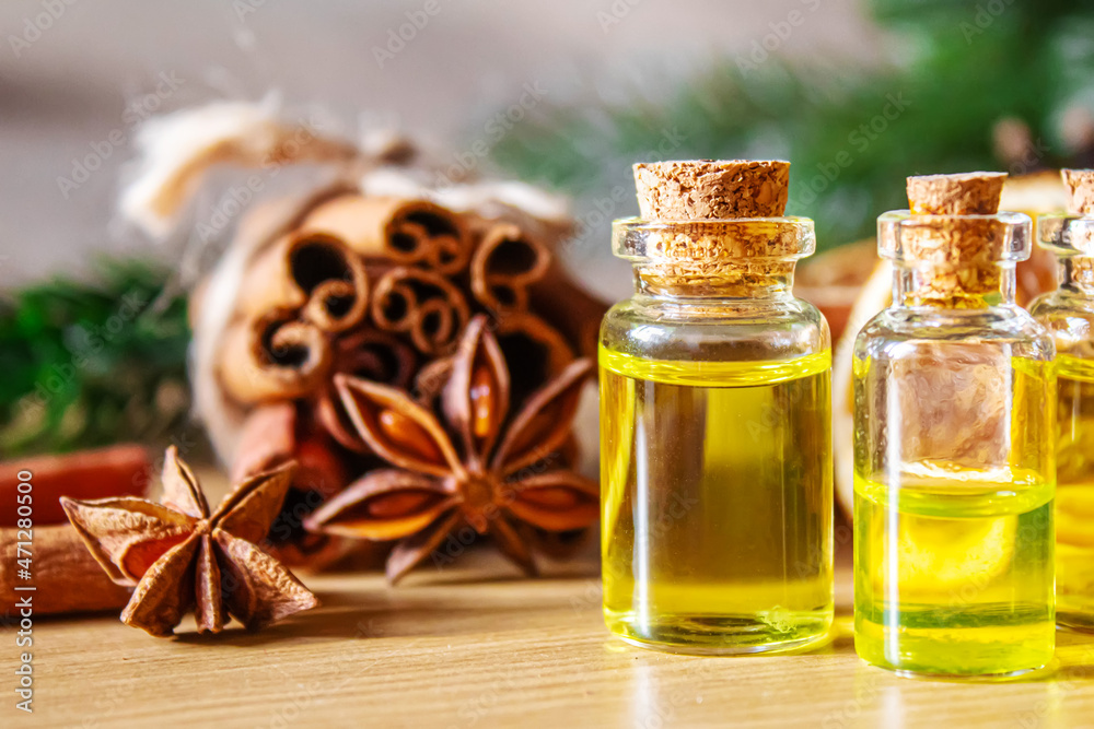 Christmas essential oils in a small bottle. Selective focus. Christmas essential oils in a small bottle. Selective focus.
