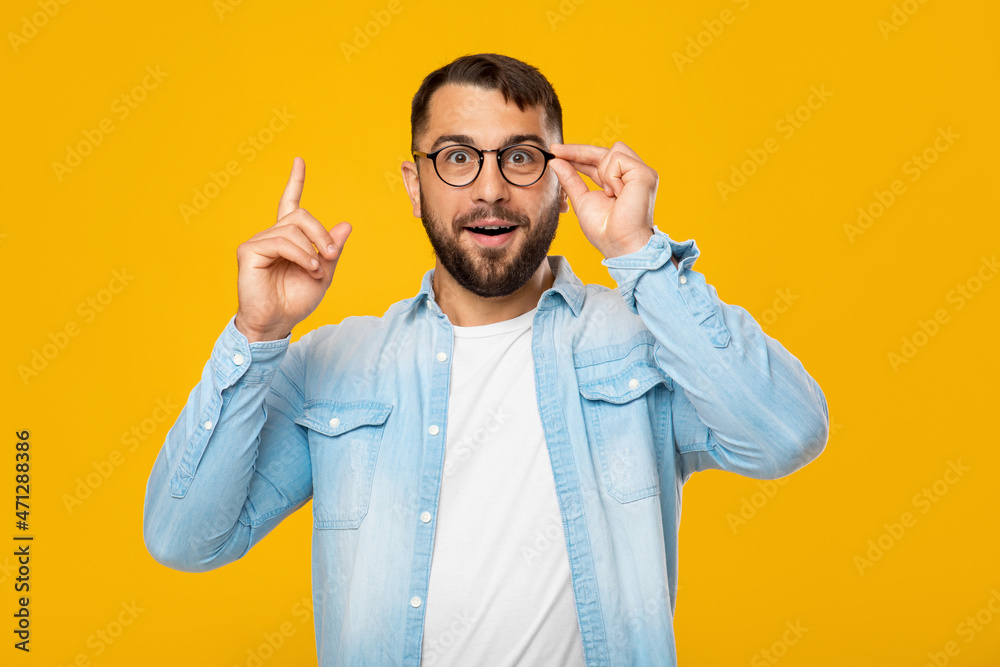 Happy inspired middle aged european man in glasses showing thumb up and have new idea Happy inspired middle aged european man in glasses showing thumb up and have new idea