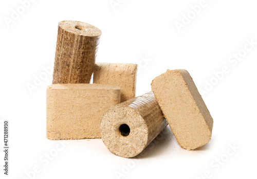 wood sawdust briquettes isolated on white background photo