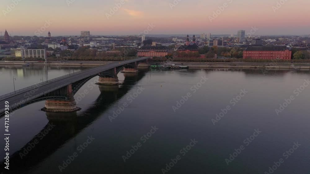 Drone video over the Rhine and Mainz waterfront with Theodor Heuss Bridge in the morning during sunrise Drone video over the Rhine and Mainz waterfront with Theodor Heuss Bridge in the morning during sunrise
