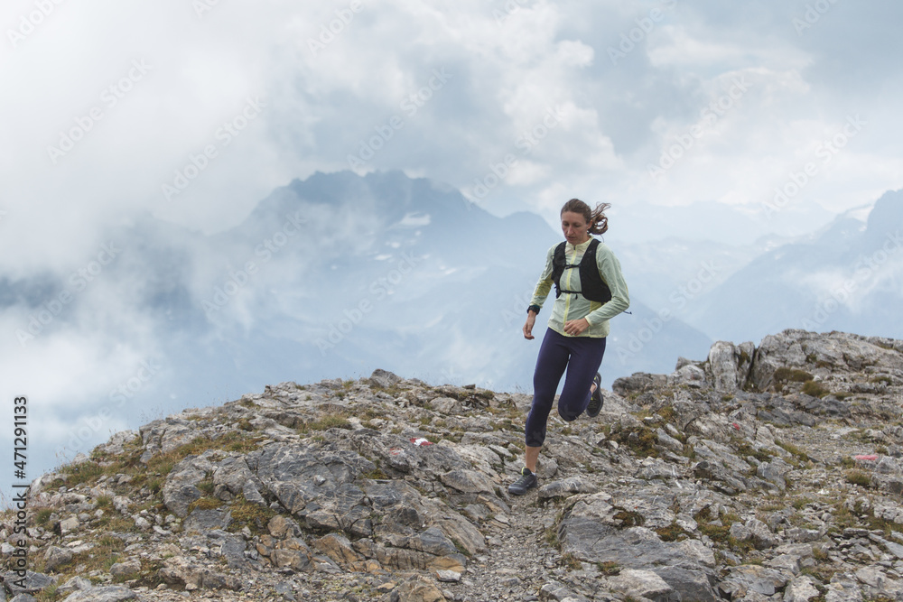 Women trail running in the European alps of Austria Women trail running in the European alps of Austria