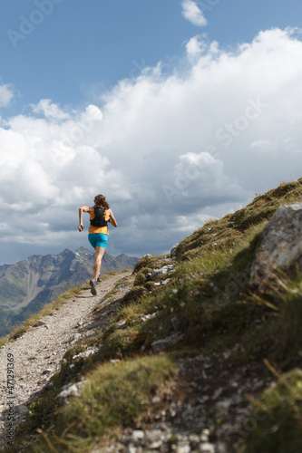 Women trail running in the mountains