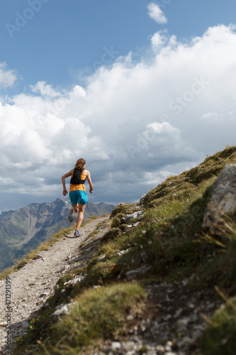 Women trail running in the European alps of Austria