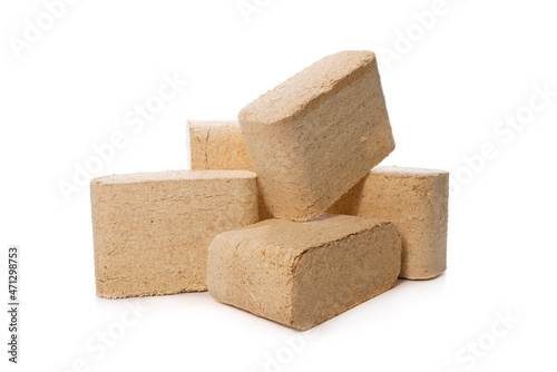 wood sawdust briquettes isolated on white background photo