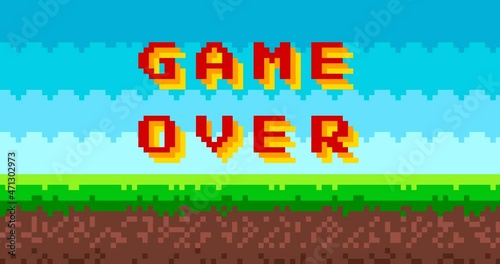 Animation of 'Game over' text on 8 bit game background. Gaming controller, symbols set. Pixel picture with sky, clouds, ground and grass. 4k video animated. photo