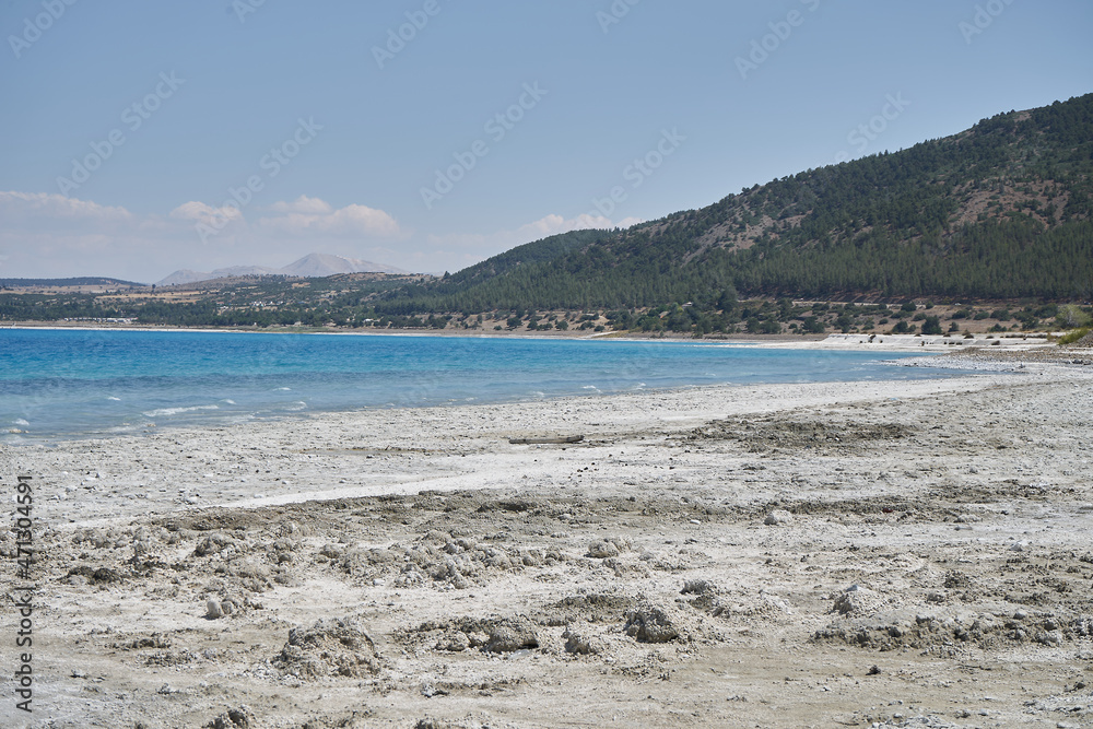  Beautiful turquoise Salda crater lake - Burdur, Turkey.Turquoise lake Salda Turkey. White mineral rich beach. Salda lake with white sand and green water. Burdur Turkey