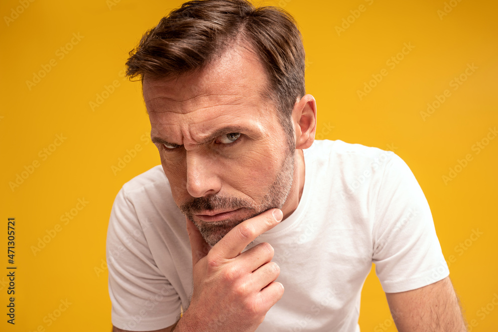 Closeup portrait of handsome man looking at camera. Attractive men with natural wrinkles. Studio shot. Closeup portrait of handsome man looking at camera. Attractive men with natural wrinkles. Studio shot.