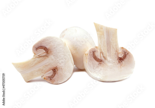 Champignons isolated on white background. Raw whole and sliced mushrooms for cooking. 
