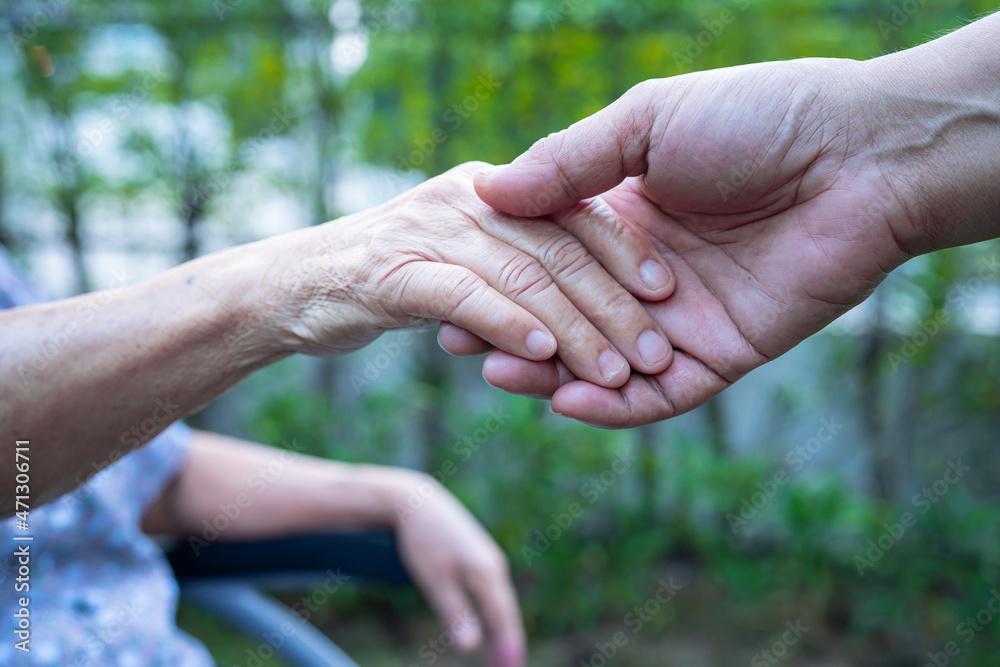 Holding hands Asian senior or elderly old lady woman patient with love, care, encourage and empathy at nursing hospital ward, healthy strong medical concept Holding hands Asian senior or elderly old lady woman patient with love, care, encourage and empathy at nursing hospital ward, healthy strong medical concept