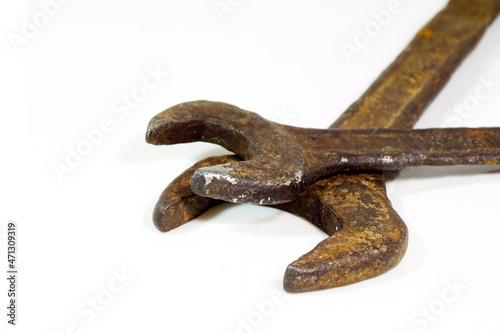 Old Rusty spanner isolated on white background.