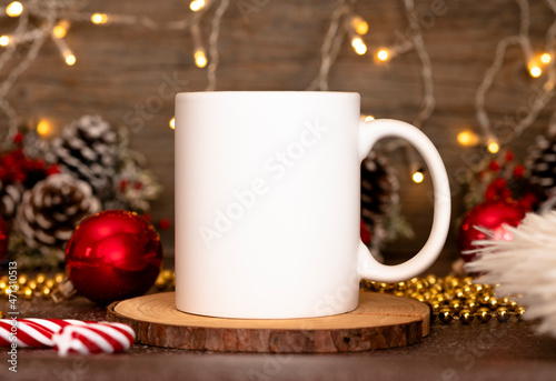 Coffee mug mockup with red christmas decorations. 11oz White mug branding Mockup. Christmas imprint photo