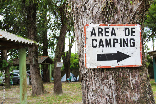 tree with sign board written Camping area.