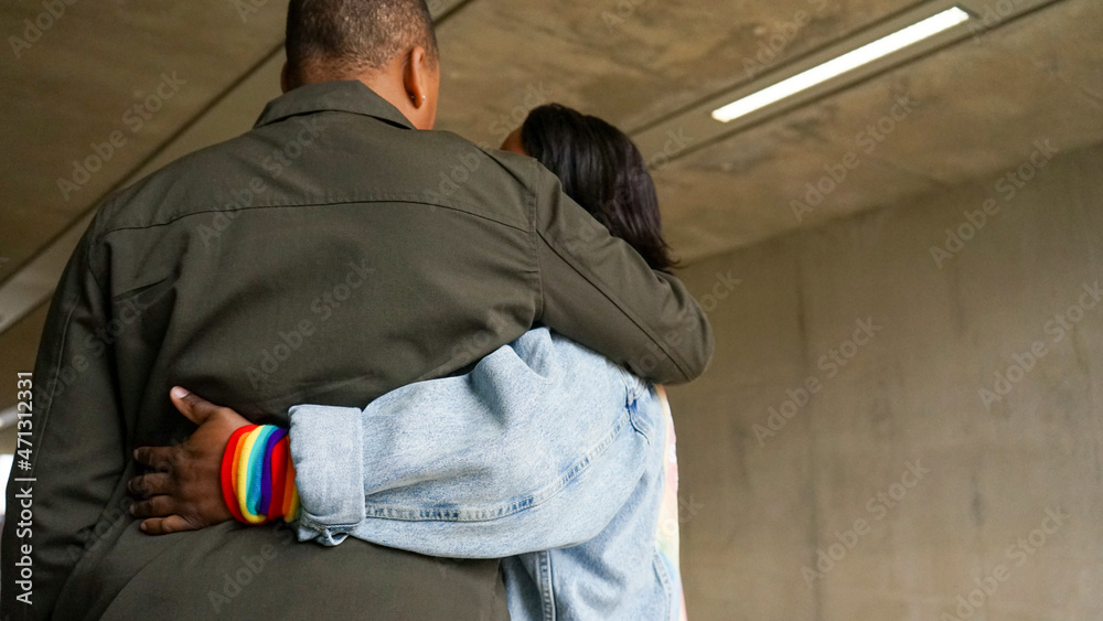 Rear view of two women embracing Rear view of two women embracing