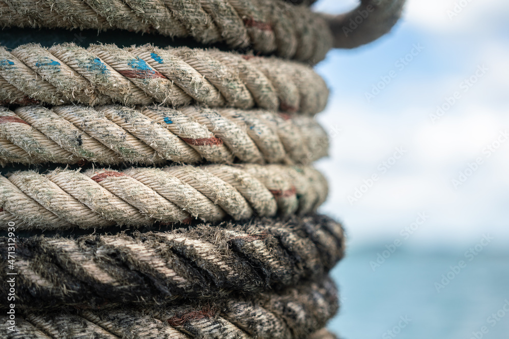Heavy rope cable which is use for anchor nautical or marine vehicle. Close-up at object texture detail.