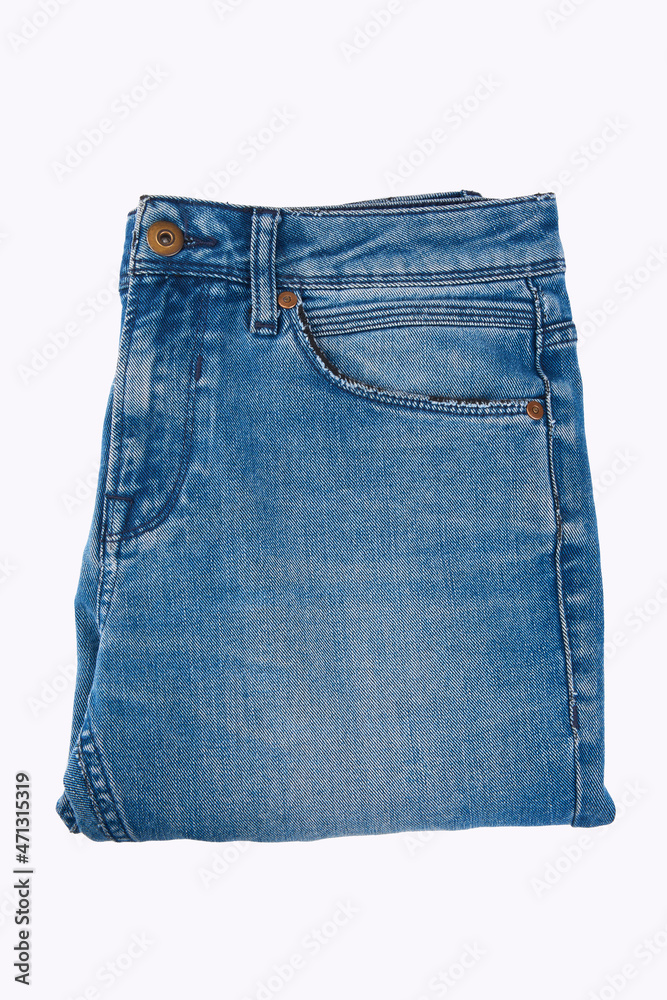 Stack of Various Shades Of Blue Jeans On White Background Denim jeans texture. Denim background texture for design. Canvas denim texture. Blue denim that can be used as background. Stack of Various Shades Of Blue Jeans On White Background Denim jeans texture. Denim background texture for design. Canvas denim texture. Blue denim that can be used as background.