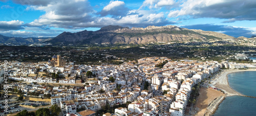 Aerial perspective of the town of Altea with its church on top in the province of Alicante, Spain, with the Sierra de Bernia in the background photo