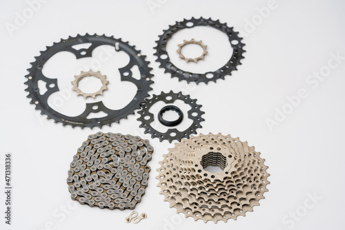 Gears, sprockets and chain of a mountain sports bike on a white background. Bicycle parts photo