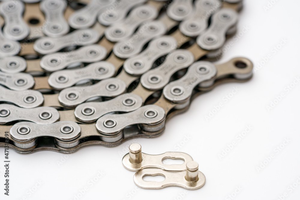 Gears, sprockets and chain of a mountain sports bike on a white background. Bicycle parts Gears, sprockets and chain of a mountain sports bike on a white background. Bicycle parts