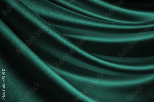 Obraz na płótnie Blue green silk satin. Soft, wavy folds. Shiny fabric surface. Luxurious emerald green background with copy space for design. Web banner. Birthday, Christmas, Xmas, Valentine, holiday, concept. w salonie