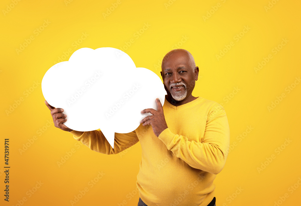 Senior black man holding empty speech bubble on orange studio background, mockup - obrazy, fototapety, plakaty 