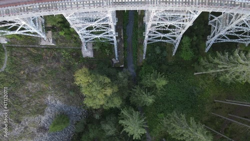 The Ziemestal Bridge in Germany. Old ice rink bridge in the forest. Great drone shot from a bridge photo