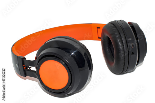 Orange - black audio headphones on a white background close up © Viktor  Shmihinskyi