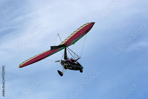 Valokuva Ultralight airplane flying in a blue sky