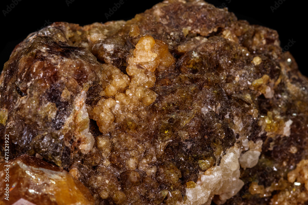macro mineral stone Grossular, Garnet, Epidote on a black background macro mineral stone Grossular, Garnet, Epidote on a black background
