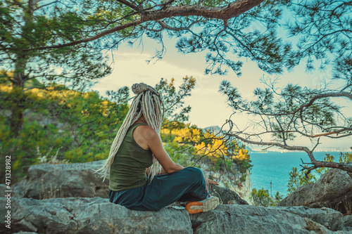 rasta girl with dreadlocks resting on the Mediterranean coast © Иван Сомов