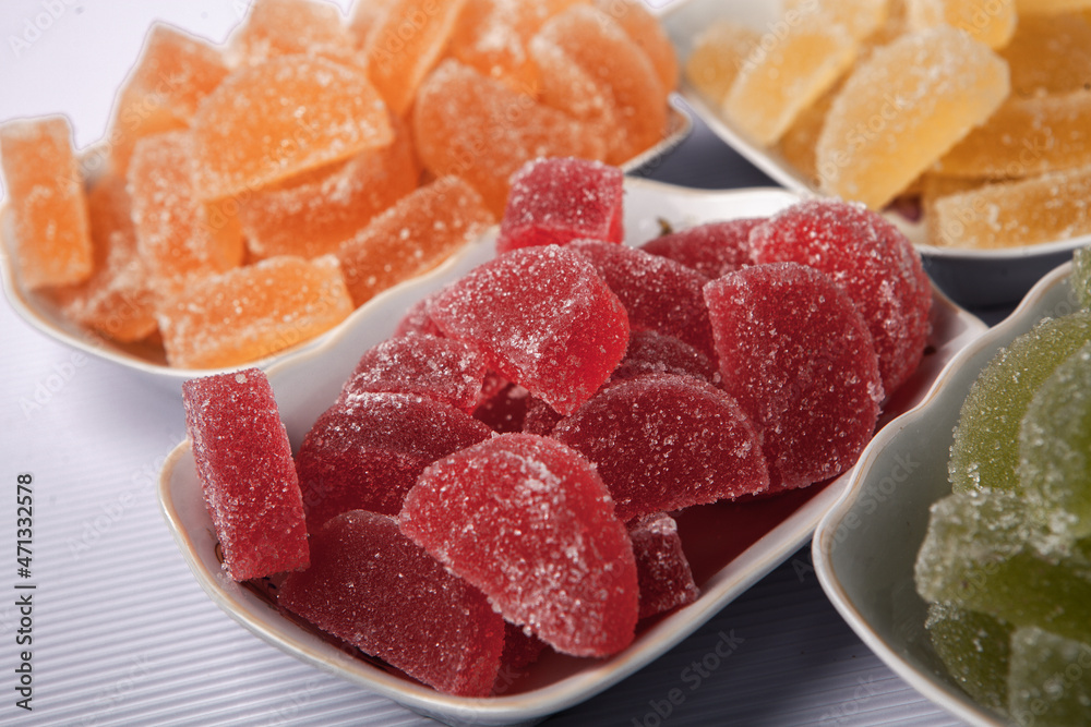 Dessert marmalade in the form of lemon and orange slices. The sweetness of jelly candy. Dessert marmalade in the form of lemon and orange slices. The sweetness of jelly candy.