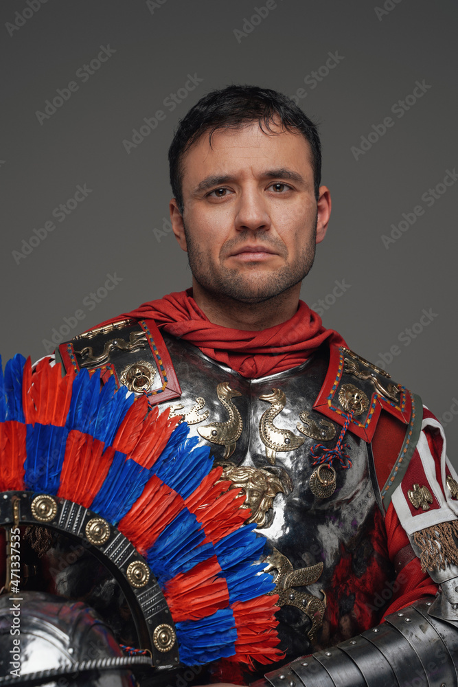 Portrait of ancient roman centurion against gray background